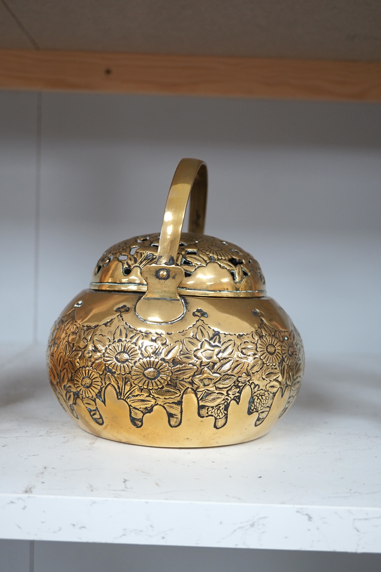 A Chinese brass basket censer and cover, 13cm high. Condition - fair.